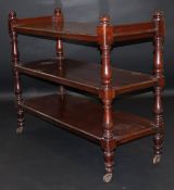 A Victorian mahogany three tier dumb waiter with baluster shaped supports,