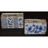 An 18th Century Delft flower brick decorated in blue and white with panels of flowers alternating