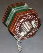 A Victorian fretwork carved rosewood cased 48 key concertina by C Wheatstone of London with green