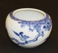 A Chinese porcelain bowl painted in underglaze blue with bird alighting from a branch and with a