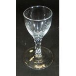 A late 18th Century wine glass with ogee shaped bowl, facet cut stem and plain foot, 12.