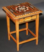 A mid 20th Century Moorish ivory and inlaid square topped table on square tapering supports united