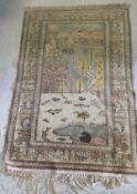 A Tabriz silk rug with hunting scenes decoration,