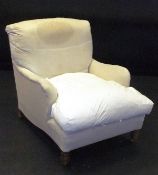 A circa 1900 Howard of London armchair in floral loose covers, with turned front legs, the back