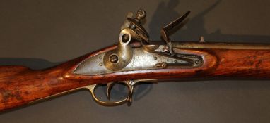 A 19th Century Brown Bess rifle, flintlock, the barrel stamped "JPR/EXR/603", walnut stock,