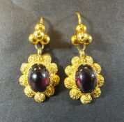 A pair of gold and garnet set cluster style earrings CONDITION REPORTS Has some light general wear