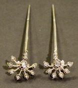 A pair of 19th Century diamond hat pins, approx 1 carat total each, approx 2.7 cm wide x 11.