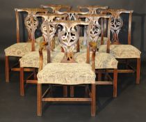 A set of seven George III mahogany dining chairs in the Chippendale manner,
