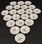 A collection of 22 20th Century Berlin porcelain plates painted with floral spray decoration and