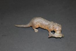 An Austrian cold-painted bronze figure of an otter with fish quarry, 17.7 cm long CONDITION