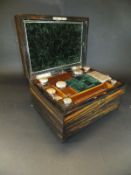 A coromandel ladies vanity box containing various jars and pots with silver lids and tops,