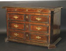A late 17th / early 18th Century Italian burr walnut and boxwood strung commode, the top with