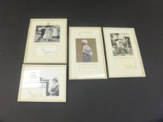 A framed and glazed black and white image of the Queen Mother with three Royal grandchildren and