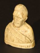 A carved bone / tooth bust of a tribal chieftan inscribed "Maori Chief Tamere" to front and "