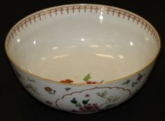 A Chinese porcelain fruit bowl, decorated in the famille-rose palette with floral sprays within