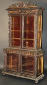 A 19th Century Anglo-Indian cabinet with applied scrolling acanthus decoration to stag's head