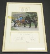 A framed and glazed image of Her Majesty The Queen with children in pony and trap, Prince Charles