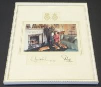 A framed and glazed image of Her Majesty The Queen and Prince Philip in Drawing Room with three