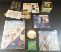 A box containing various World coinage and commemorative coins and tokens including 1766 calendar