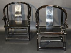 A pair of 19th Century Chinese ebonised hardwood (probably huanghuali) horseshoe back armchairs, the