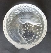 A Lalique glass ash tray of circular form with impressed frosted image of a fish amidst bubbles,