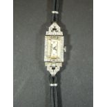 An Art Deco 1930's ladies cocktail wristwatch, the platinum case set with small diamonds,
