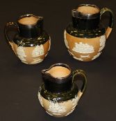 A graduated set of three early 20th Century Doulton Lambeth stoneware harvest jugs,