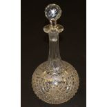 A large Victorian cut glass decanter of onion form with grape and vine etched decoration,