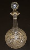 A large Victorian cut glass decanter of onion form with grape and vine etched decoration,