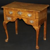 An 18th Century walnut lowboy,