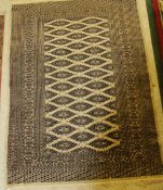 A silk Bokhara rug,