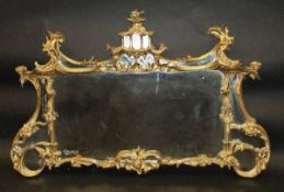 A 19th Century carved giltwood and gesso mantel mirror in the Chinese Chippendale taste with