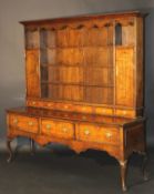 A George III Shropshire oak and cross-banded dresser with parquetry banded decoration,