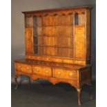 A George III Shropshire oak and cross-banded dresser with parquetry banded decoration,
