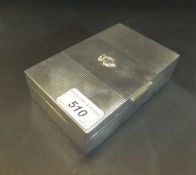 A George VI silver cigarette box with engraved striped decoration to top and bearing Royal cypher