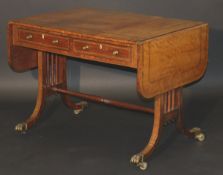 A 19th Century mahogany sofa table, the drop leaf top with rosewood banded decoration, over two