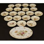 A 20th Century Meissen part dinner service painted with floral sprays and with shaped gilt decorated