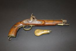 A Victorian military hammer action pistol, the metalwork with various engravings, the walnut stock