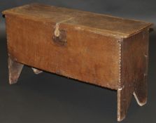 An 18th Century oak six plank hutch with incised and moulded decoration,