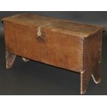 An 18th Century oak six plank hutch with incised and moulded decoration,