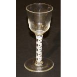 A late 18th Century wine glass with ogee shaped bowl, the stem with spiral tapes to plain foot, 14.
