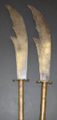 A pair of late 19th Century Chinese pole arms with steel blades and brass tsuba,