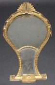 A 19th Century carved giltwood and gesso framed wall mirror with shell surmount over an inverted