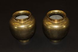 A pair of Chinese brass vases with engraved decoration of phoenix and flowers,