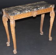 A 19th Century Continental pine pier table with veined black marble top, the base with central shell
