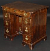 An 18th Century oak kneehole desk,