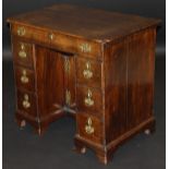 An 18th Century oak kneehole desk,