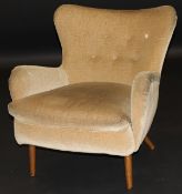 An Ernest Race (1913-1964) DA2 low button back chair in a pale gold upholstery,