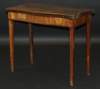 A George III mahogany serpentine fronted card table,