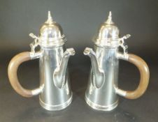 A pair of silver cafe au lait pots,